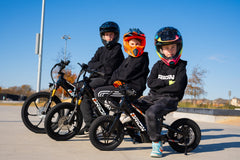 Kids with their Orion e-balance bikes at the skatepark