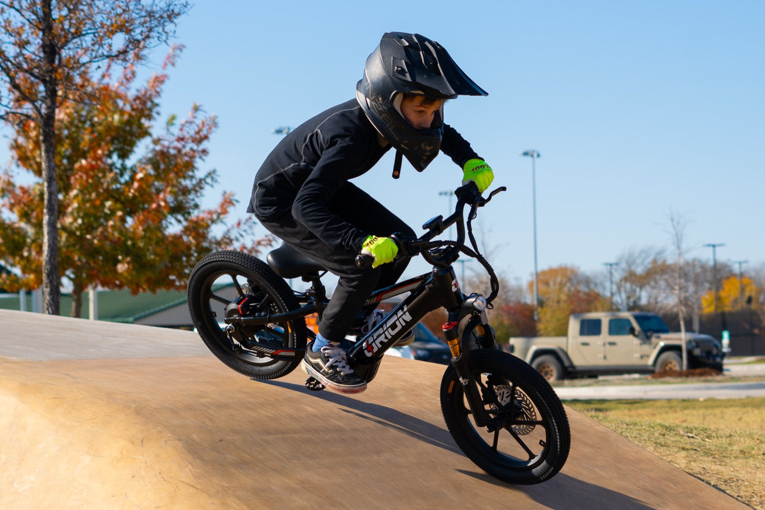 A kid riding the Orion e20x at the pump track